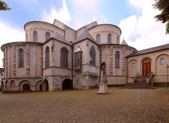 What are the characteristics of Romanesque architecture style examples?